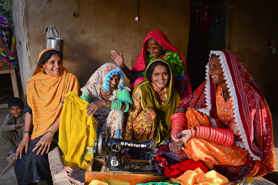 Coworkers Hidayyat, Sahida, Zarina Abdullah, Paari and Radan pooled their savings under CARE's Community Infrastructure Improvement Project in Pakistan and started a joint business, selling groceries and homemade clothes. Wolfgang Gressman/CARE