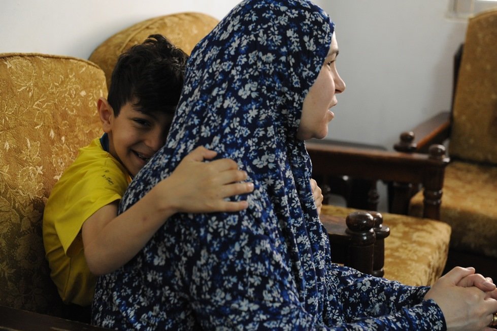 Hanna, 50, escaped the war in Syria with her five children, including Batul, 9 and Moutaf, 6.