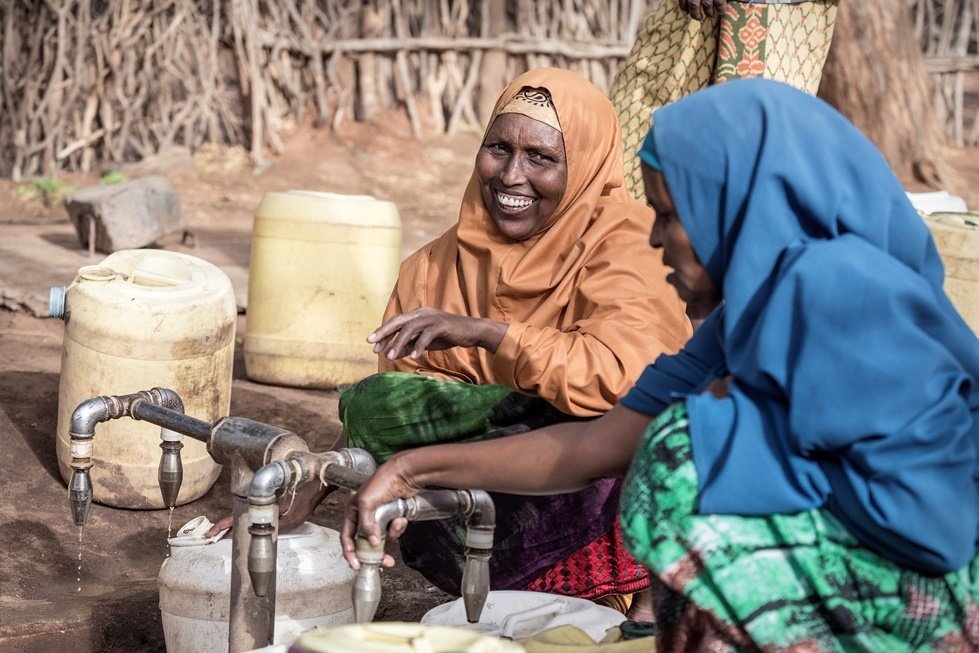 Photo: Sven Torfinn. Kenya, Dadaab refugee camp, February 2017.  Women fetching water at water points. CARE and ECHO are providing portable drinking water to hundreds of thousands of people in the world's biggest refugee camp.