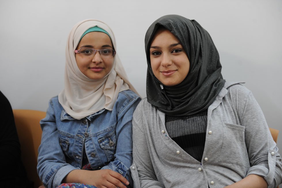 Yamama, 17, with her friend Shahed