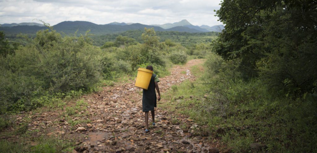 Precious walks for water in Mashvingo, Zimbabwe. Photo: Alana Holmberg/CARE 2017
