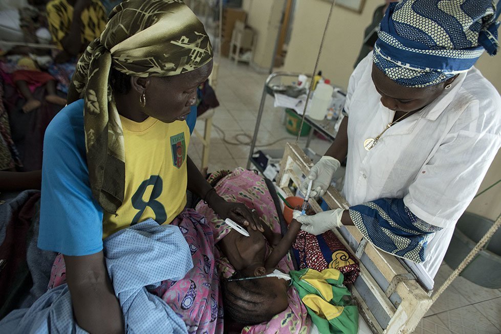 Staff at the hospital attend to a young child