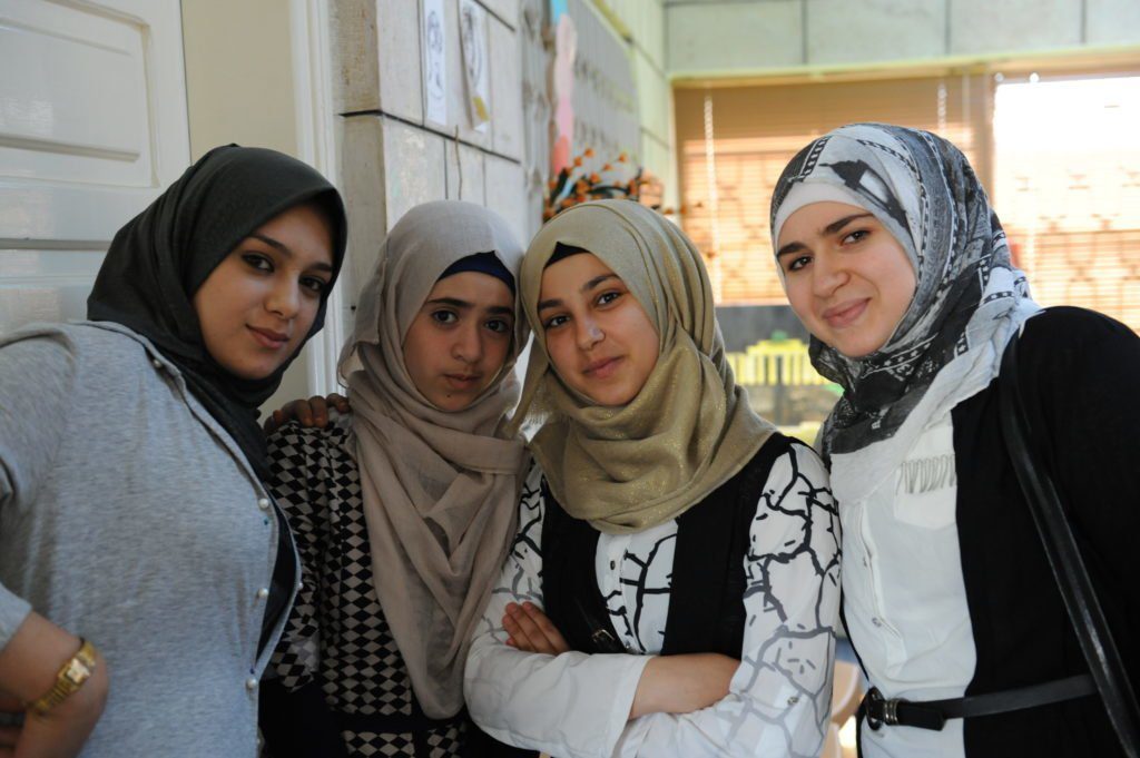 Syrian teens participate in peer to peer support groups in a CARE community centre in Irbid, Jordan. Part of CARE's psychosocial programming, teenage girls come together to discuss topics ranging from personal narrative to early child marriage, stress management to gender-based violence. Credit: Mary Kate MacIsaac/CARE