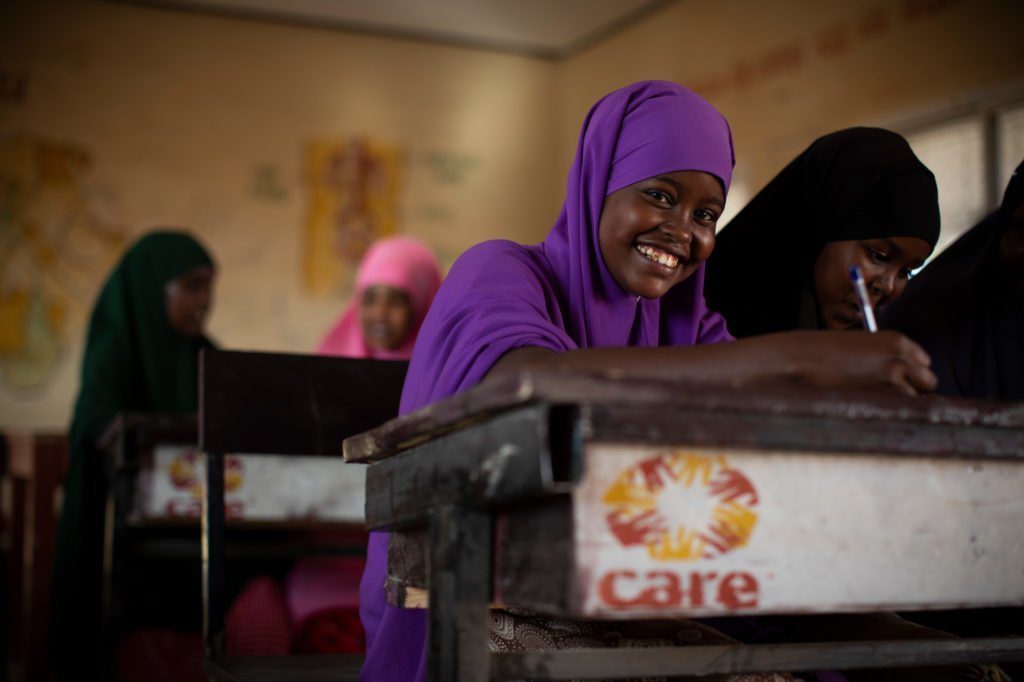 CARE in Somalia school girl at desk