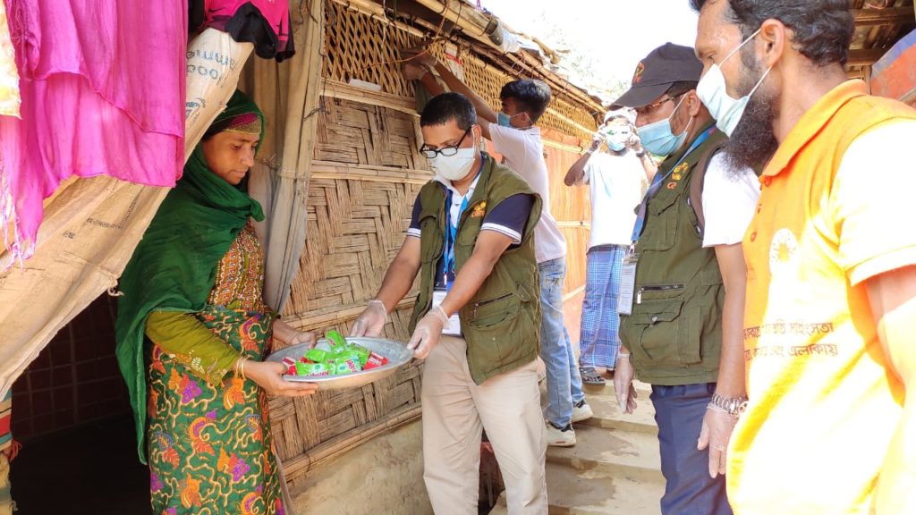 CARE staff in Cox's Bazaar distributing supplies