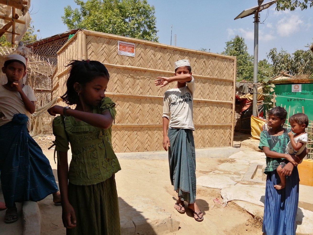 Children in Cox’s Bazaar, Bangladesh, home to the world’s largest refugee camp, participate in a CARE workshop on coughing and sneeze etiquette. 