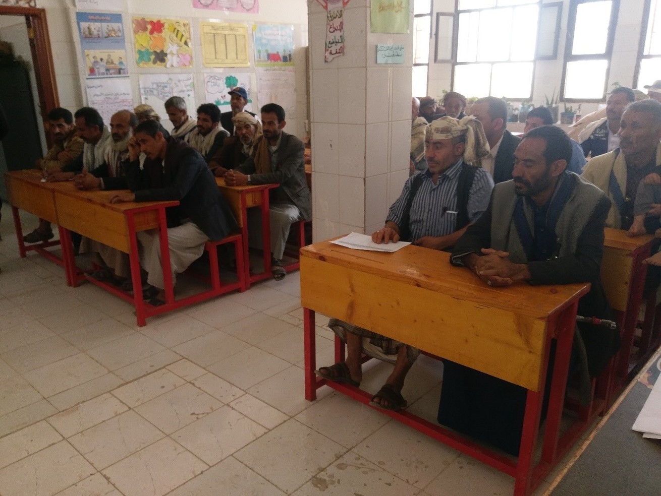 Stakeholders discuss educational change during a dialogue session at Al-Hareth school