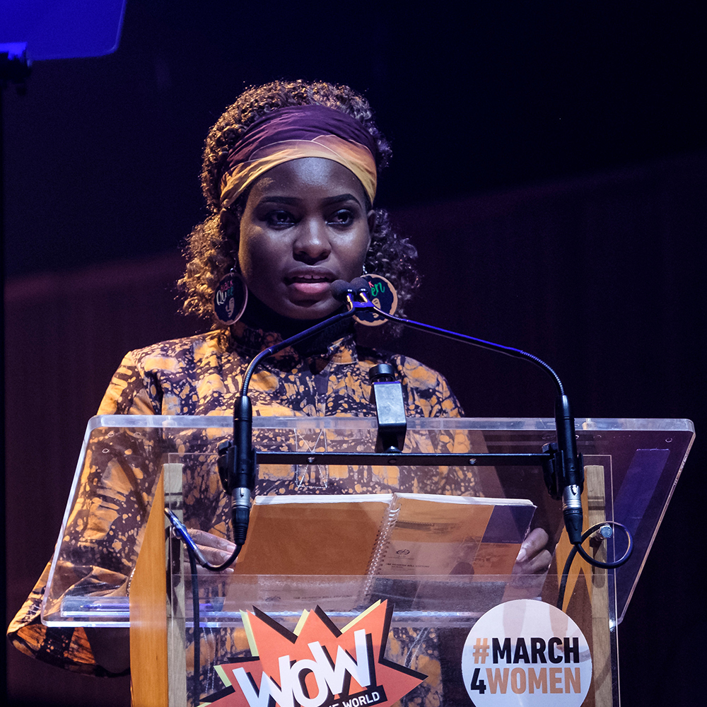 <p>Hilda Flavia Nakabuye, climate activist from Uganda, speaking at the #March4Women rally at the Southbank Centre.</p>
<p>&nbsp;</p>
<p>CARE International UK&rsquo;s annual #March4Women event to celebrate International Women&rsquo;s Day (8th March 2020) featured a rally at the Southbank Centre, London, followed by a march through central London to Parliament Square, where thousands of marchers were greeted with a grand finale of live music and powerful speeches from feminists and climate activists. The event celebrated the power and passion of women on the frontlines of the climate crisis, and marchers were asked to raise their voices for gender equality and climate justice.</p>
<p>&nbsp;</p>
<p>Equality campaigners Helen Pankhurst, Bianca Jagger, Shola Mos-Shogbamimu, Uganda&rsquo;s Hilda Flavia Nakabuye, and 15-year-old climate activist Scarlett Westbrook were among those leading the march and speaking, along with Mayor of London Sadiq Khan. Actors Natalie Dormer, Nicola Coughlan, Himesh Patel, Sanjeev Bhaskar, Camilla Thurlow, Mary Olabisi and Su McLaughlin read verbatim testimonies of people devastated by the climate crisis, arranged by playwright Tess Berry-Hart. A panel debate on the climate crisis and gender justice featured journalist Lucy Siegle, climate scientist Dr Tamsin Edwards, gender and climate expert Madara Hettiarachchi, and asylum seeker and activist Beauty Musewe. Singers Emeli Sand&eacute;, RAYE, Kaiser Chief&rsquo;s Ricky Wilson, L&aring;psley, and the Urban Voices Collective (performing with the Bond quartet) provided entertainment and inspiration. Actor George MacKay and poets Nikita Gill, Maja Antoine-Onikoyi, and Selina Nwulu inspired with their words. BBC broadcaster and journalist Emma Barnett hosted the rally and actor, broadcaster and co-founder of the UK Women&rsquo;s Equality Party, Sandi Toksvig, hosted the grand finale. Music at the Southbank Centre rally and the Parliament Square grand finale was produced by celebrated compose