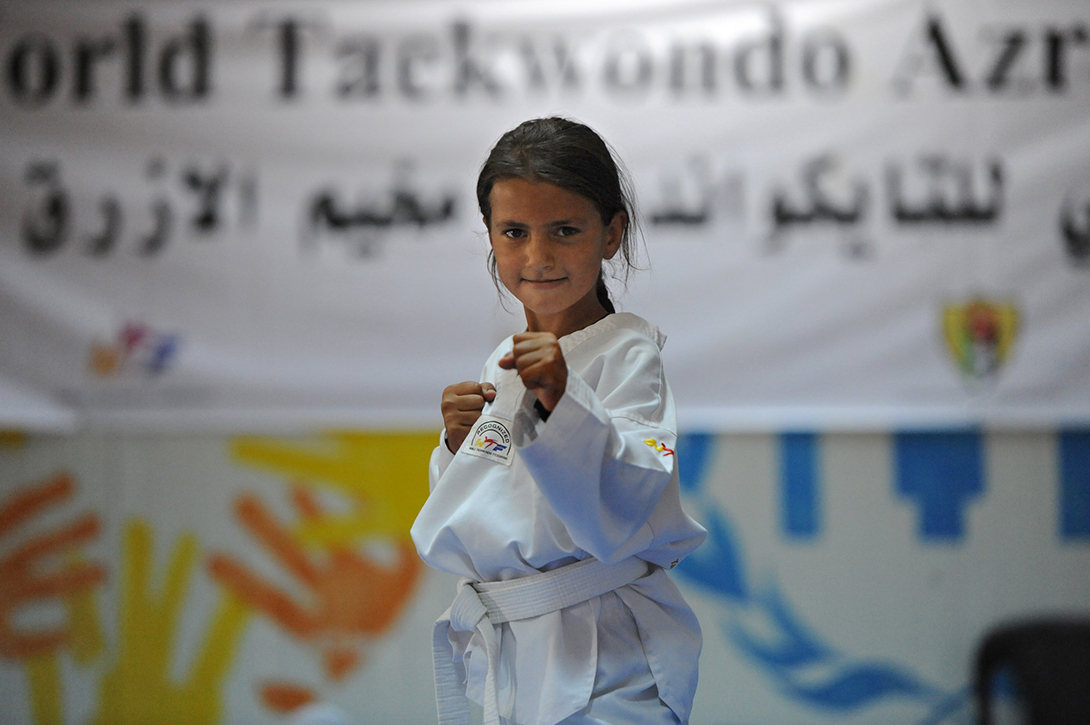 Rayan lives in in Azraq refugee camp in Jordan where CARE supports Taekwondo classes for Syrian girls in its community centre. Her coach Asef el Sabah says he sees the heart of a champion in Rayan.