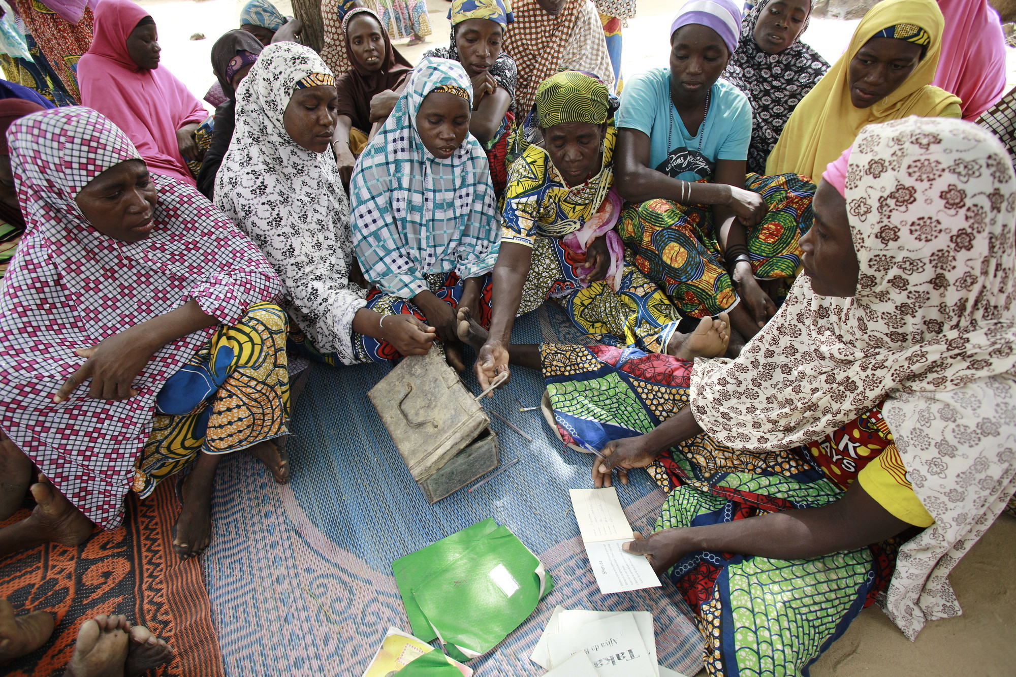 Women come together at a VSLA meeting in in Kagadama, Niger, where CARE began its pilot savings and loan program nearly 30 years ago. Photo: Josh Estey/CARE