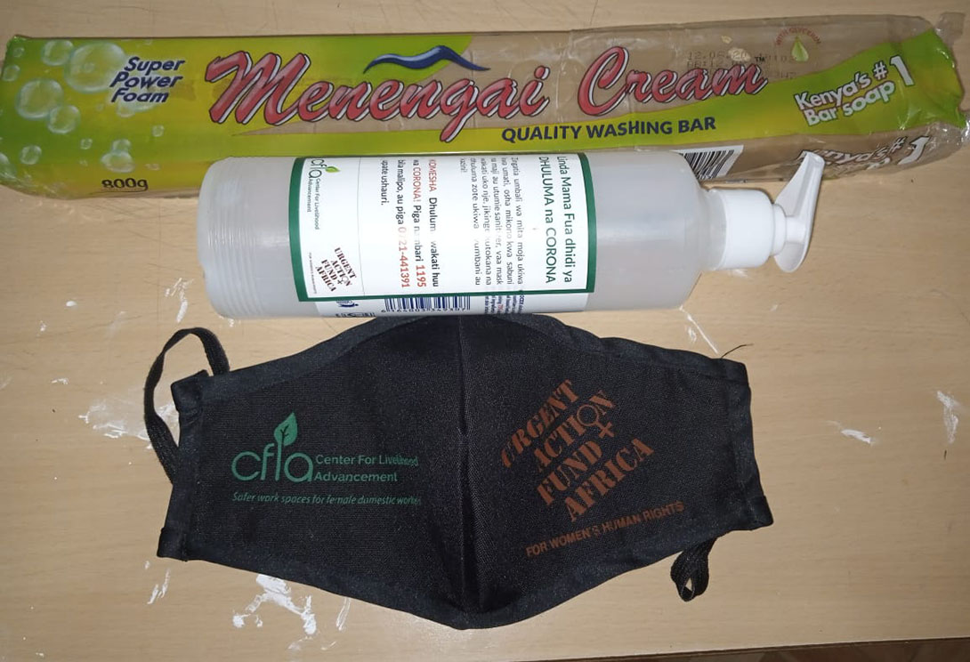 Protective kit items: hand santizer with help line phone number on the label, face mask and soap. Photo: 