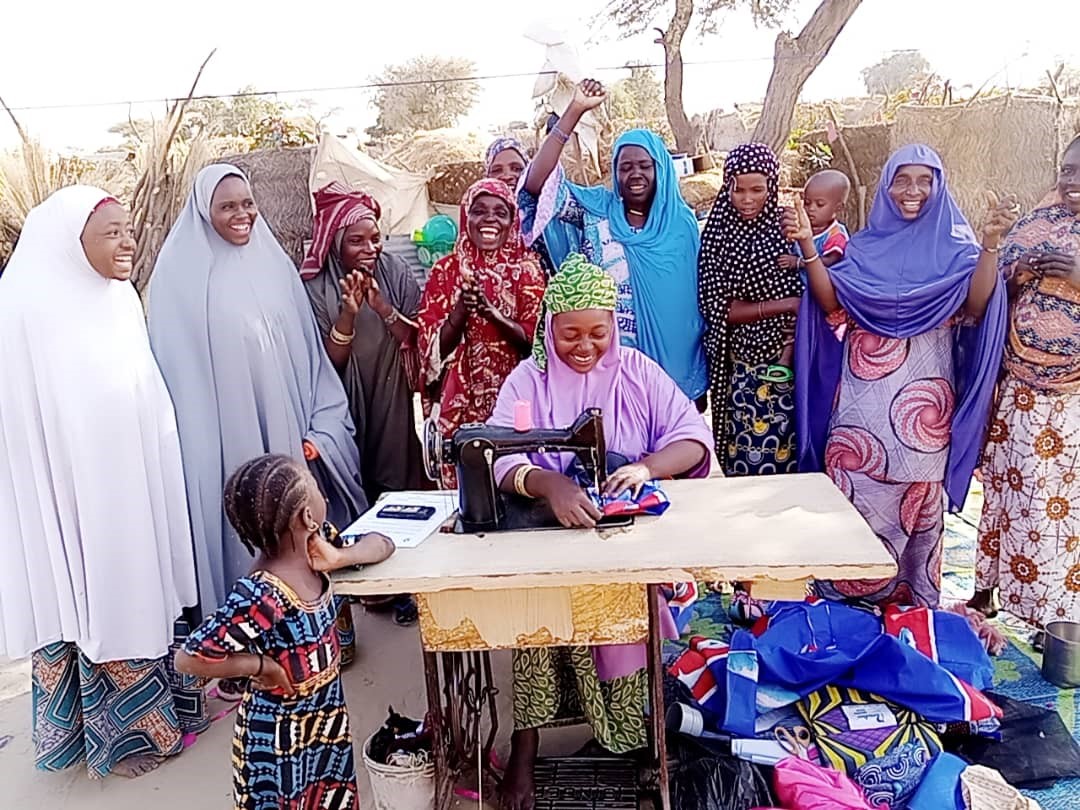 Lami with her savings group in Niger. © CARE Niger