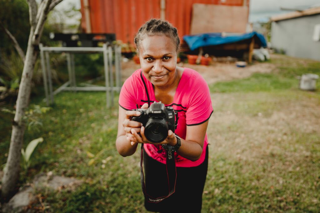 Aspiring photographer and Vanuatu Photo Project participant Ann-Ruth has her portrait taken by mentor Valerie Fernandez.