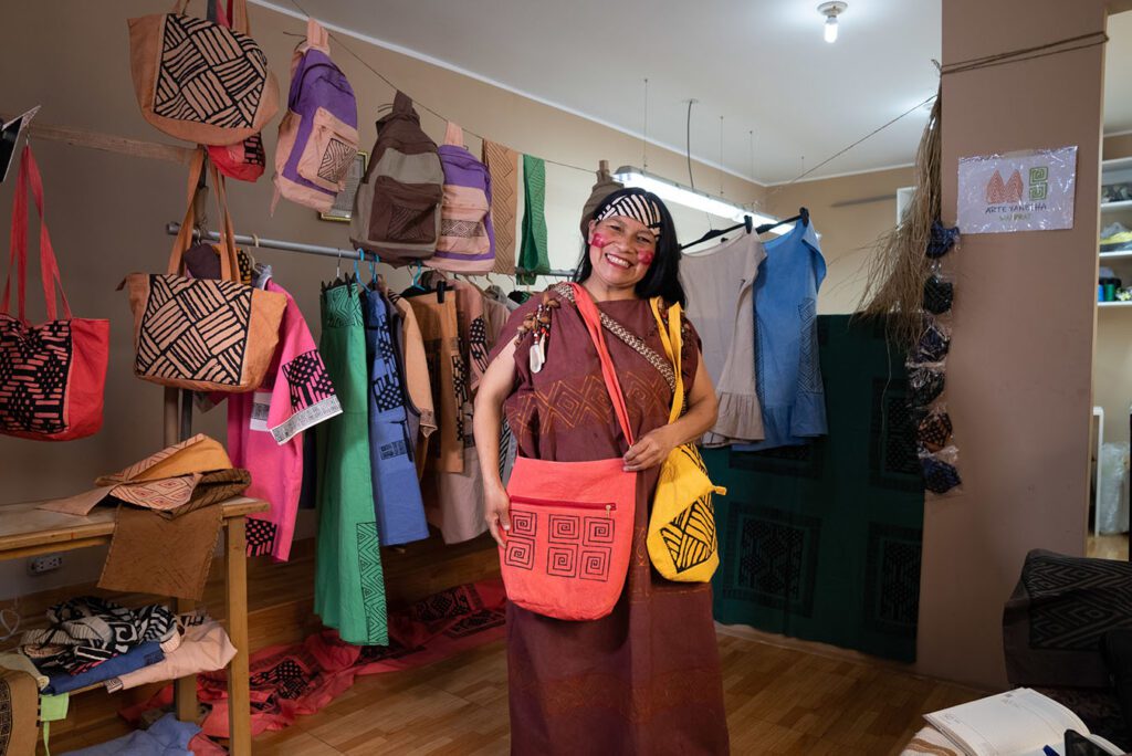Mery Neli Salazar Pedro shows off the handmade products she produces through her family artisan business 'Arte Yanesha Amazónica' from her home for ten years. They produce clothing, accessories and homewares, all with Amazonian designs.