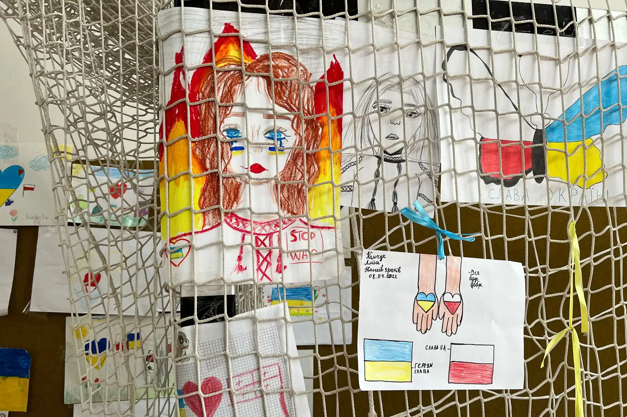 Some of the many drawings by Ukrainian refugee children that were informally displayed at an arts and crafts station in a converted school gym, Hala Sportowa, Lubycza Królewska.