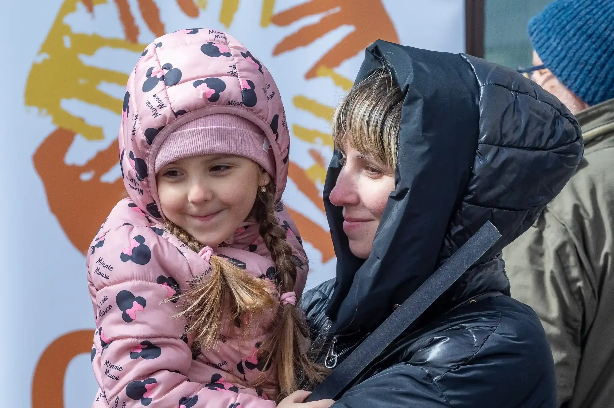 Ukrainian refugee Marina embraces her daughter, Arina, moments after passing through border control into Poland near the town of Hrebenne. Mother and daughter were fleeing the Sumy region in Northwest Ukraine. CARE is working with our partners Polish Humanitarian Action (PAH) at the border and elsewhere to provide food, water, clothing and other necessities to refugees.