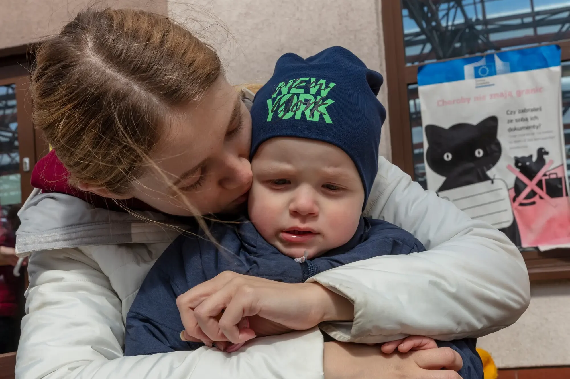 Ukrainian refugee Marina shares a moment with her son, Timur, moments after passing through border control into Poland near the town of Hrebenne. Mother and son were fleeing Pactava in Ukraine. CARE is working with our partners Polish Humanitarian Action (PAH) at the border and elsewhere to provide food, water, clothing and other necessities to refugees.