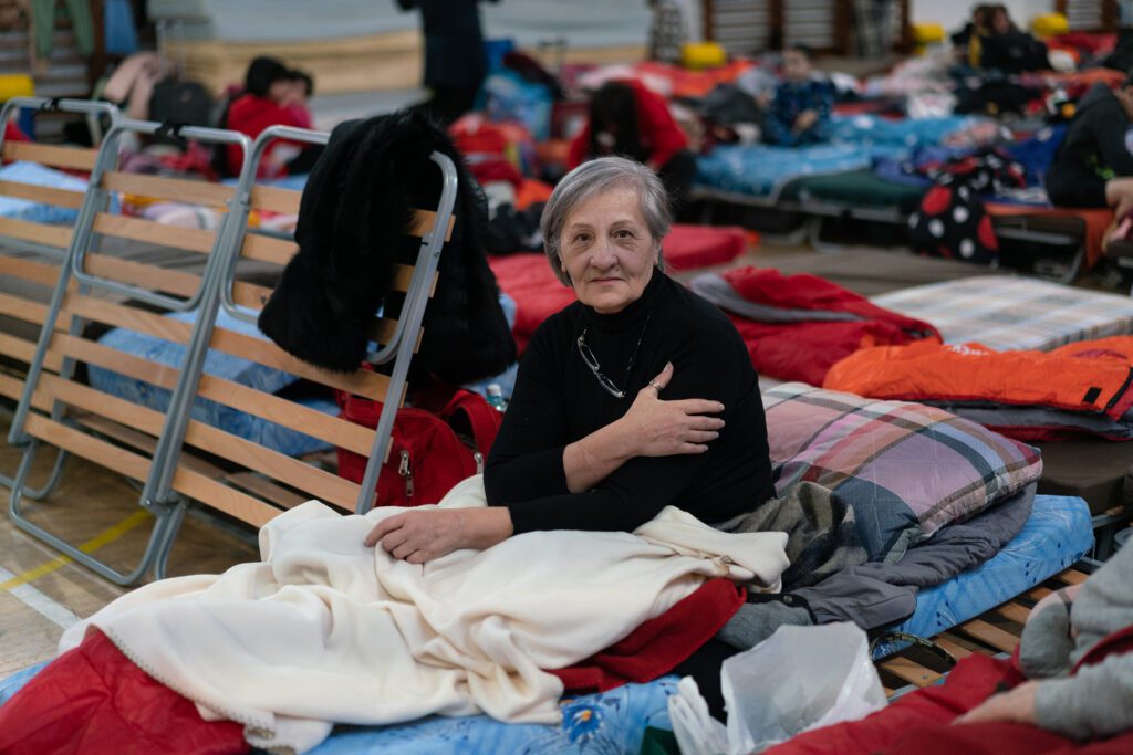 Lydia is staying at a temporary shelter in Romania after leaving southern Ukraine. CARE’s partner SERA is donating clothes and other basic items to support the center. Phot by: Lucy Beck/CARE