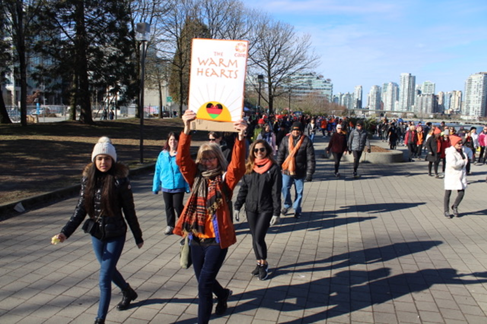 Group of smiling females marching together outdoors1