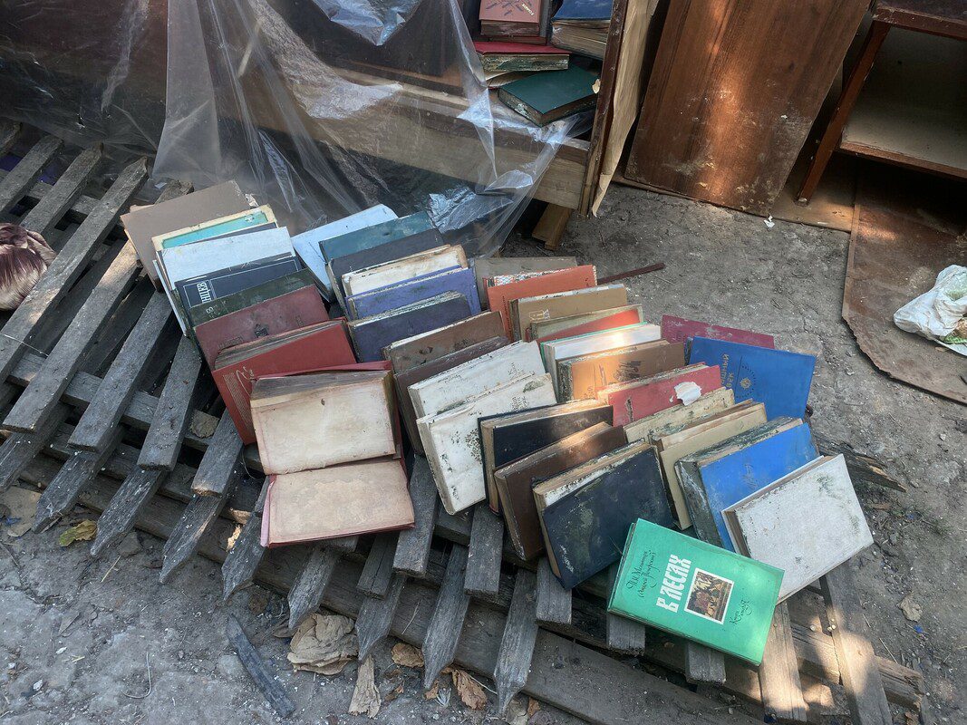 A pile of books rest on a pallet