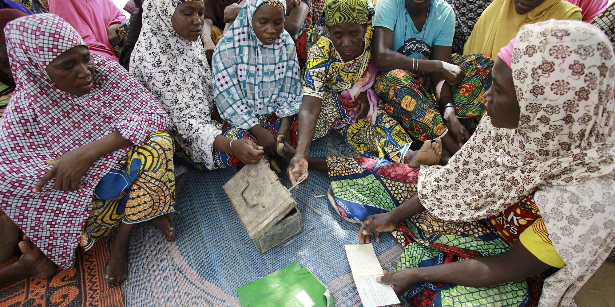 Women come together at a VSLA meeting in in Kagadama, Niger, where CARE began its pilot savings and loan program nearly 30 years ago. Photo: Josh Estey/CARE