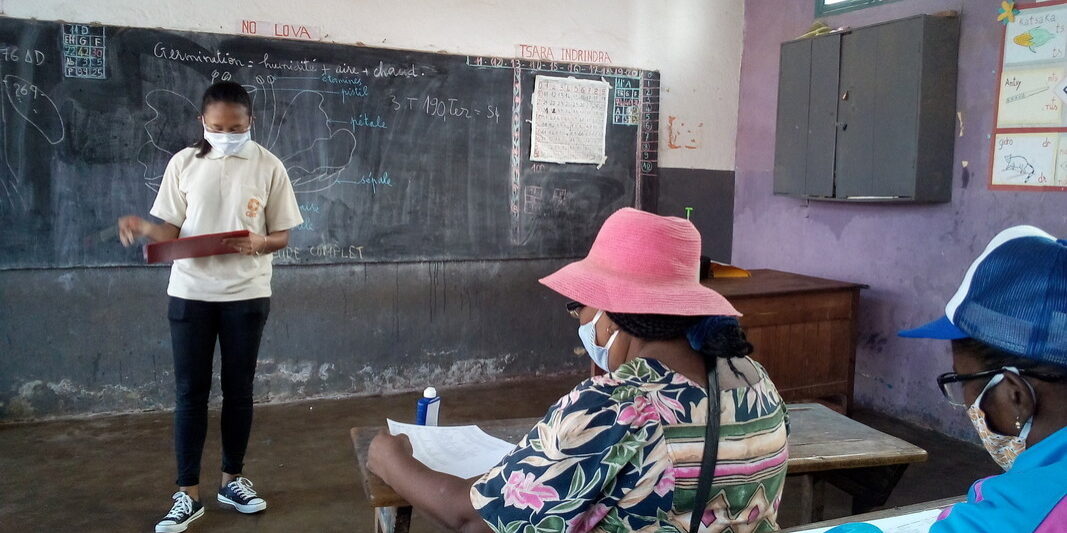 CARE Madagascar staff conducting a local disaster risk reduction committee involved in conducting Covid-19 response activities. 