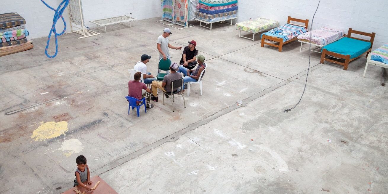 A group of Venezuelan migrants gather in a shelter in Quito, Ecuador