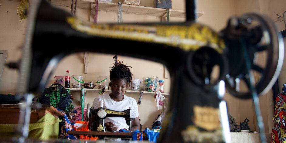 Katraelle Johnson, 34 years old and mother of two children, had to retrain when Covid-19 arrived. Her grocery store was no longer receiving customers. Katraelle now makes children's clothing which she sells online. "I wonder if we'll be able to go back to our old life," she worries. "I don't know if I can get my shop back. It's total uncertainty and anxiety." Porto Novo, Benin, 2020. Photo ©Laeïla Adjovi/CARE