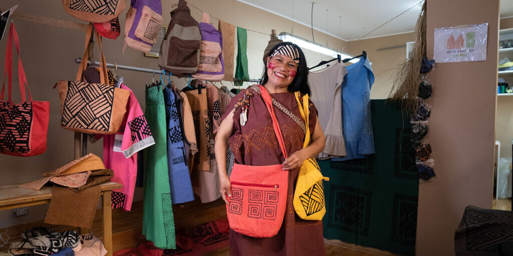 Mery Neli Salazar Pedro shows off the handmade products she produces through her family artisan business ‘Arte Yanesha Amazónica’ from her home for ten years. They produce clothing, accessories and homewares, all with Amazonian designs.